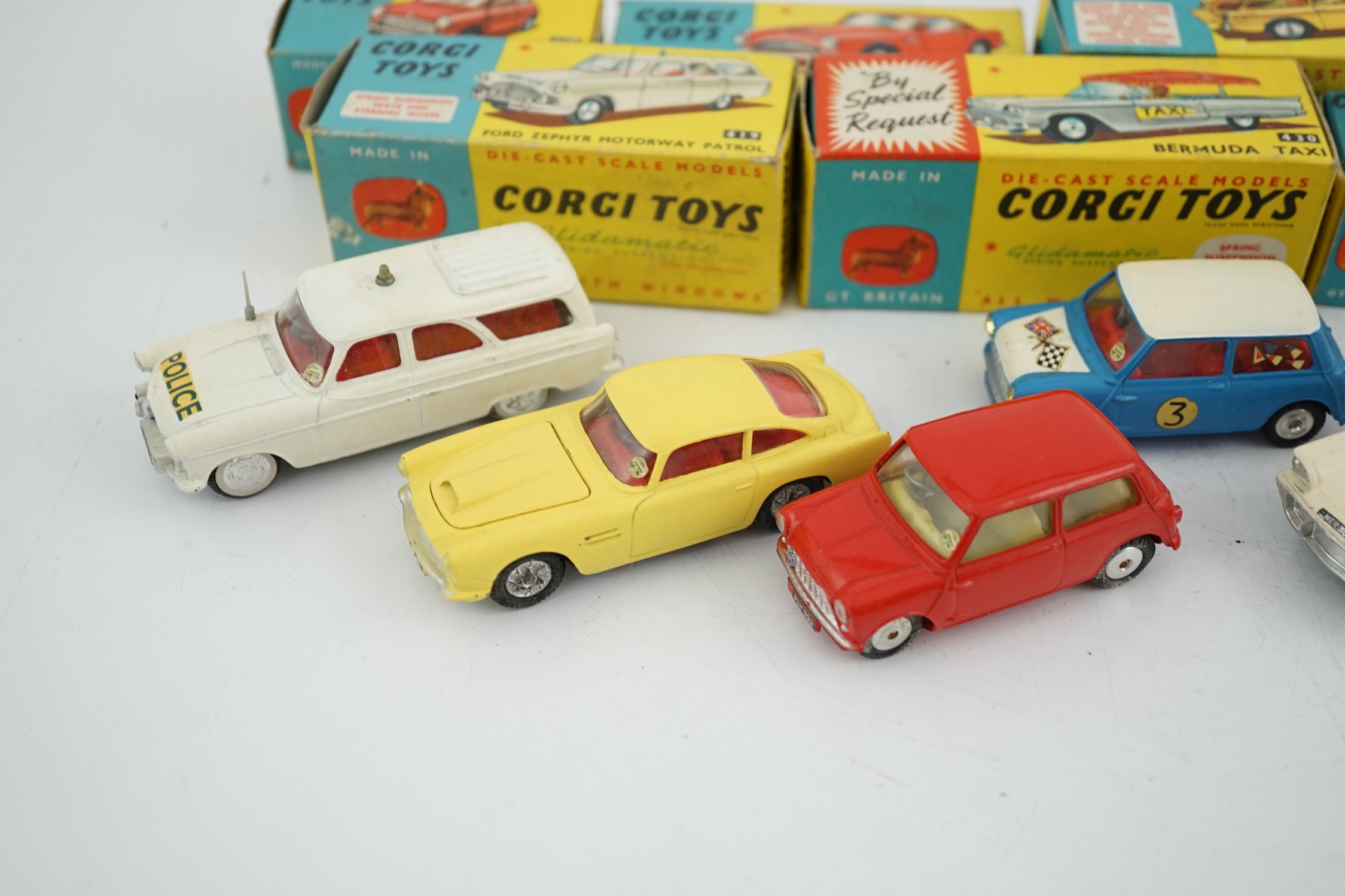 Six boxed Corgi Toys cars; Aston Martin DB4 in yellow (218), Austin seven in red (225), Morris Mini Cooper competition model (227), Ford Zephyr motorway patrol (419), Ford Thunderbird Bermuda Taxi (430), Citroen Safari (